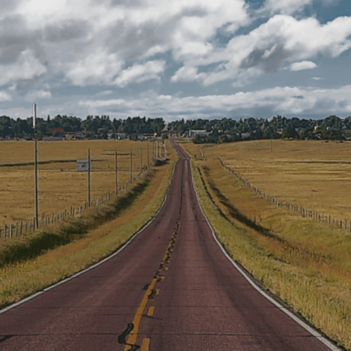 scenic road in Nebraska with fields on each side