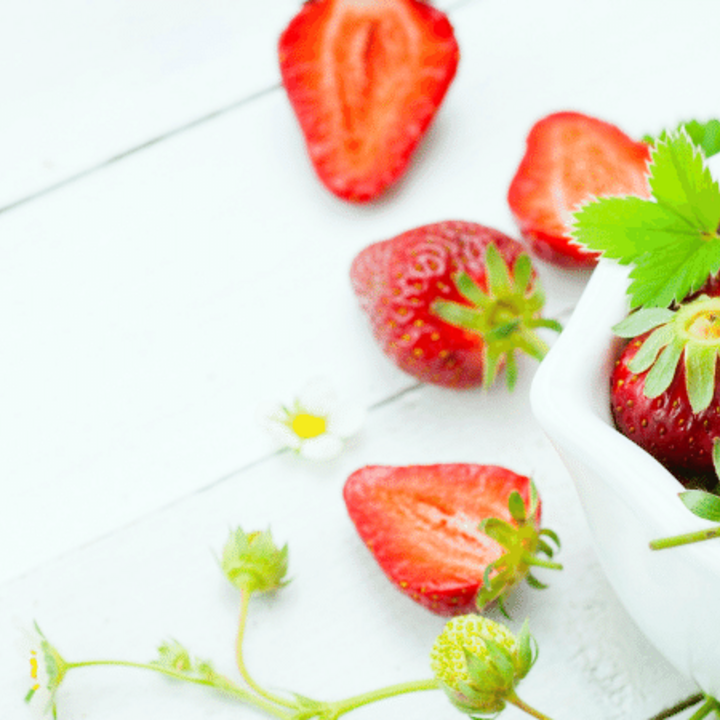 strawberries in a bowl on a table