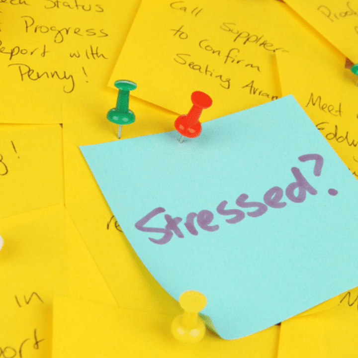 sticky notes with a lot of to-do items that is causing stress