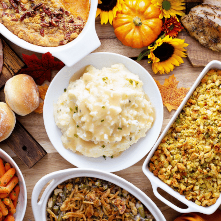 thanksgiving table with turkey and sides