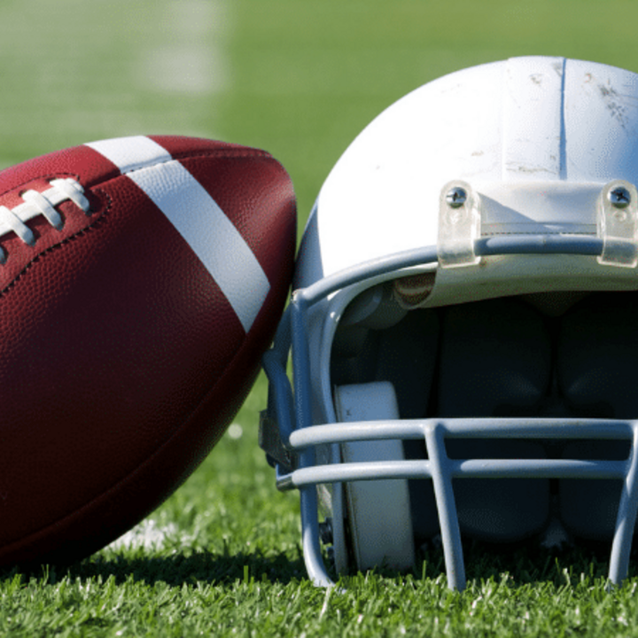 football and helmet on the field