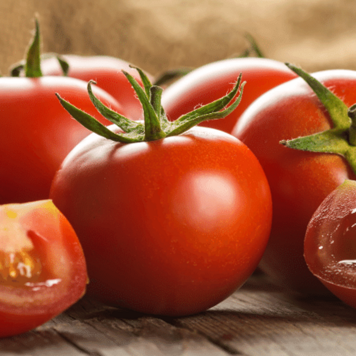 red tomatoes on a wooden table