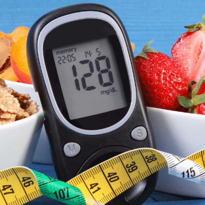 diabetes supplies such as glucose meter, healthy food, dumbbell, and measuring tape