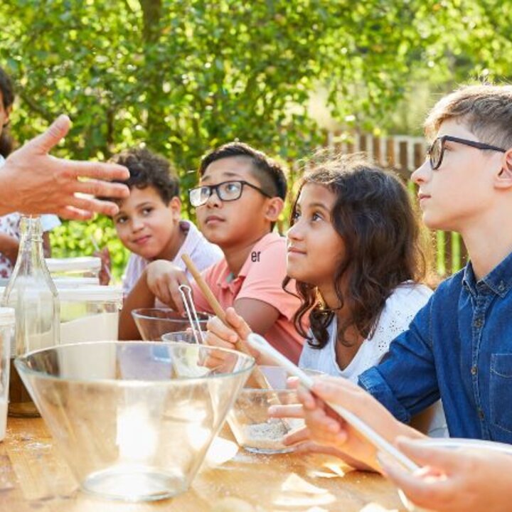 youth cooking outdoors