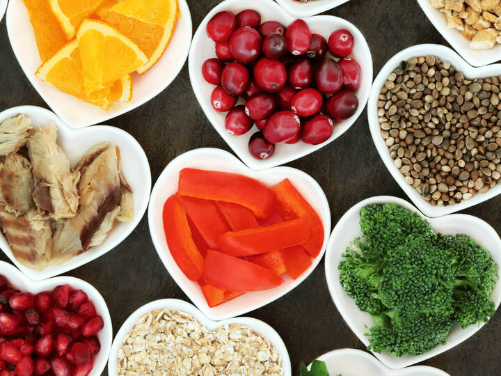 Fruit and vegetables in heart-shaped plates.