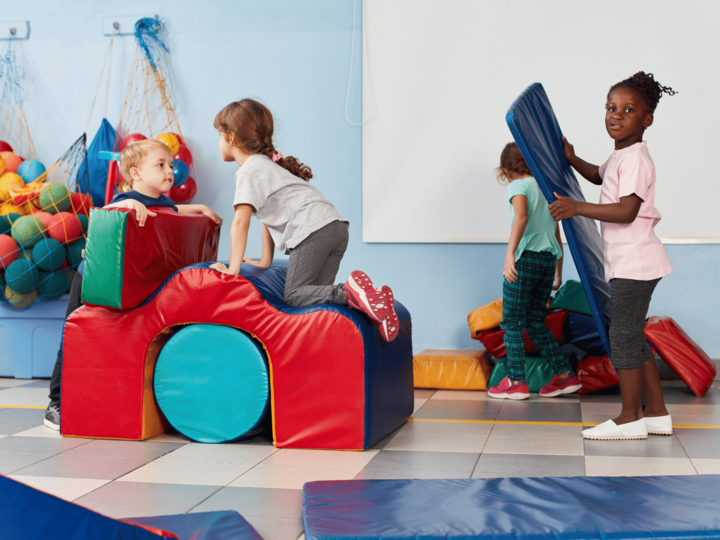 group of kids playing gymnastics