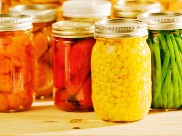 home canned foods such as corn, carrots, green beans, and tomatoes