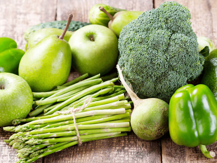 Pile of green fruits and vegetables.