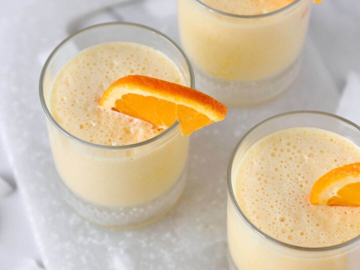 orange slushie in glass cups