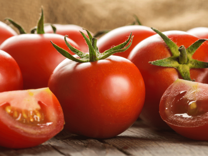 red tomatoes on a wooden table