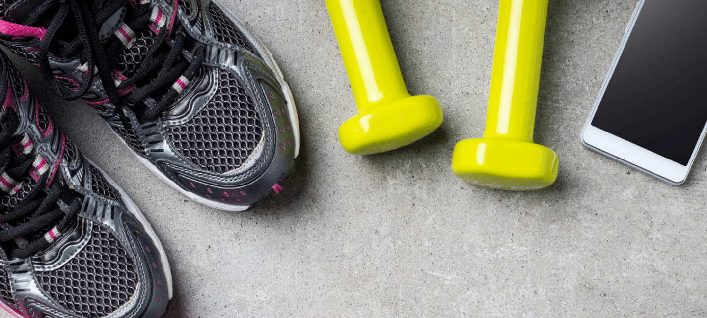 fitness background with tennis shoes, dumbbells, and cell phone