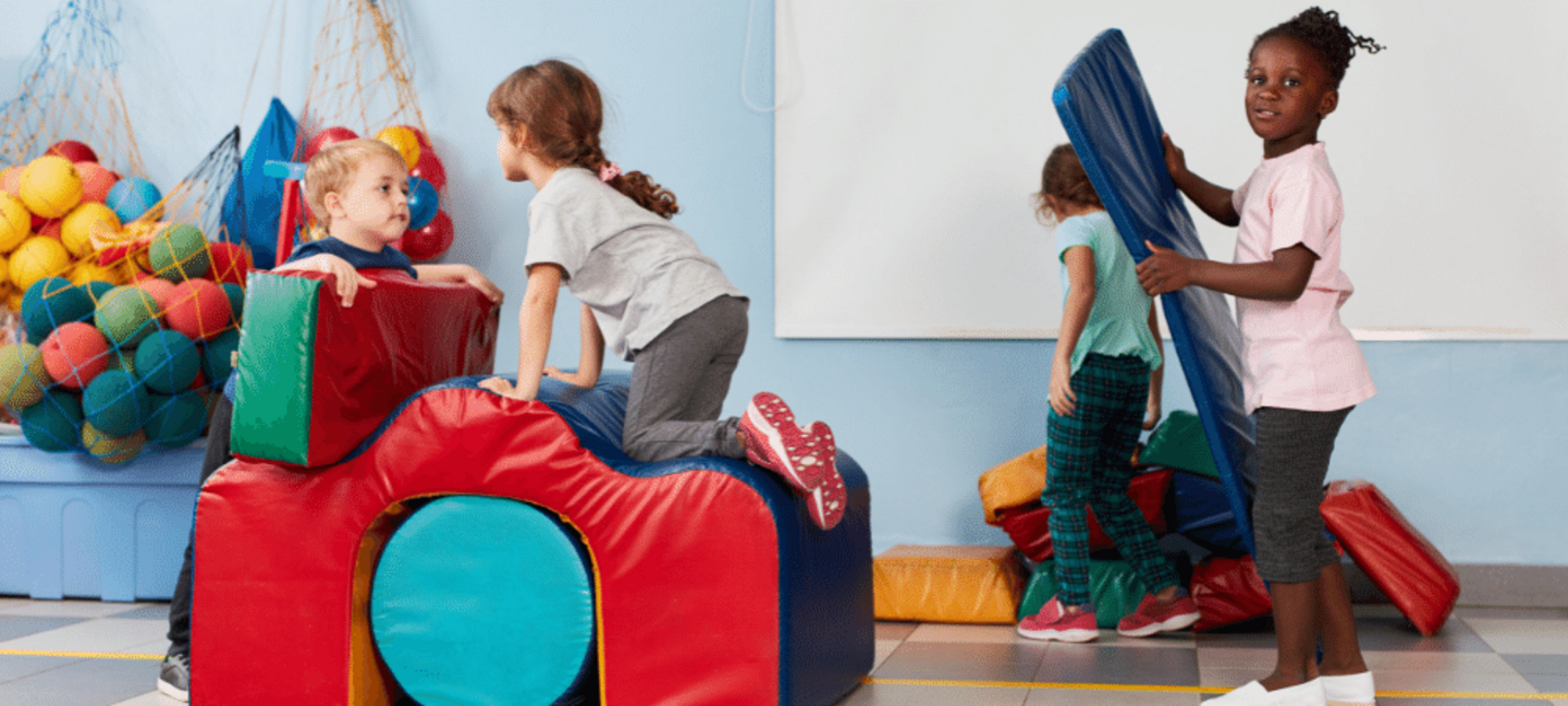 preschoolers playing in the gym