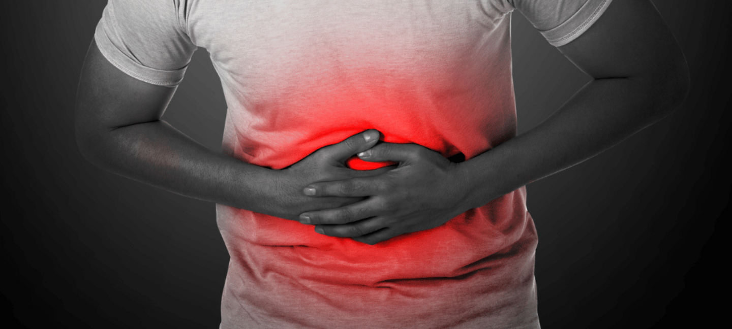 A person is experiencing a stomach ache due to food poisoning.