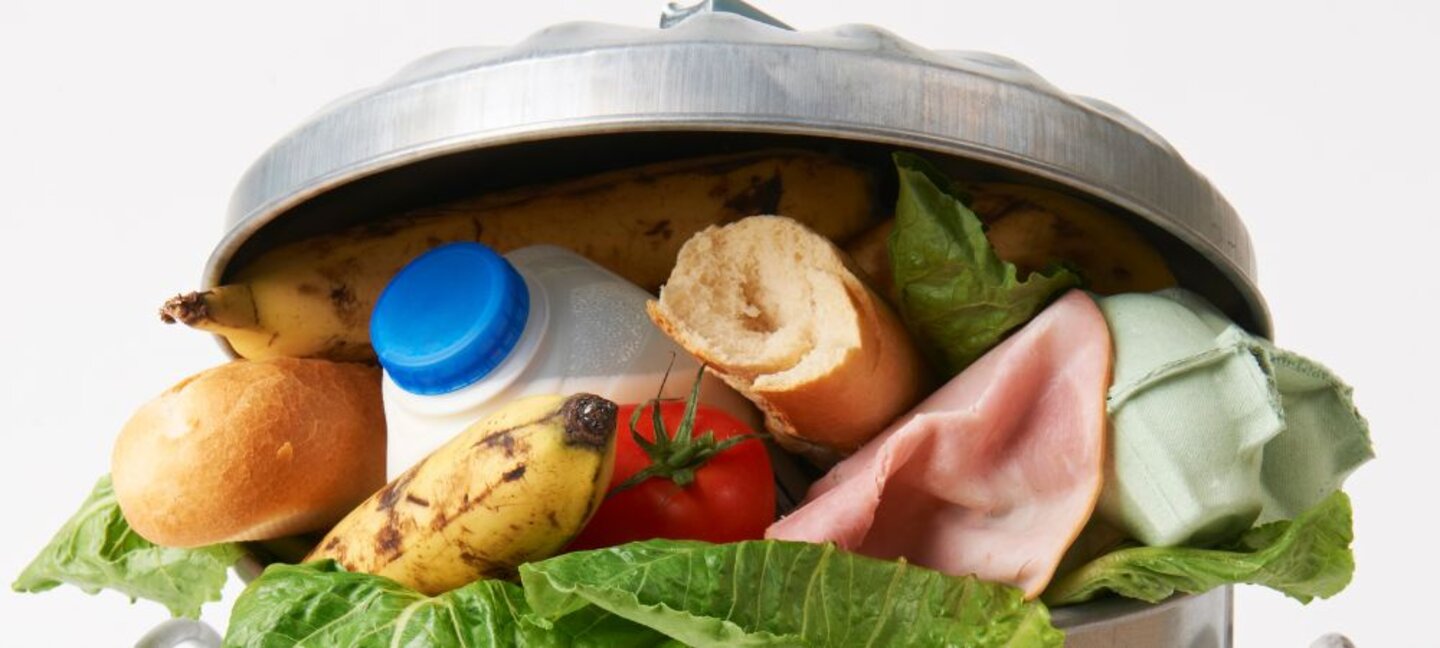 food wasted in a trash can