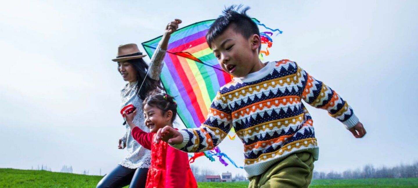 family flying a kite