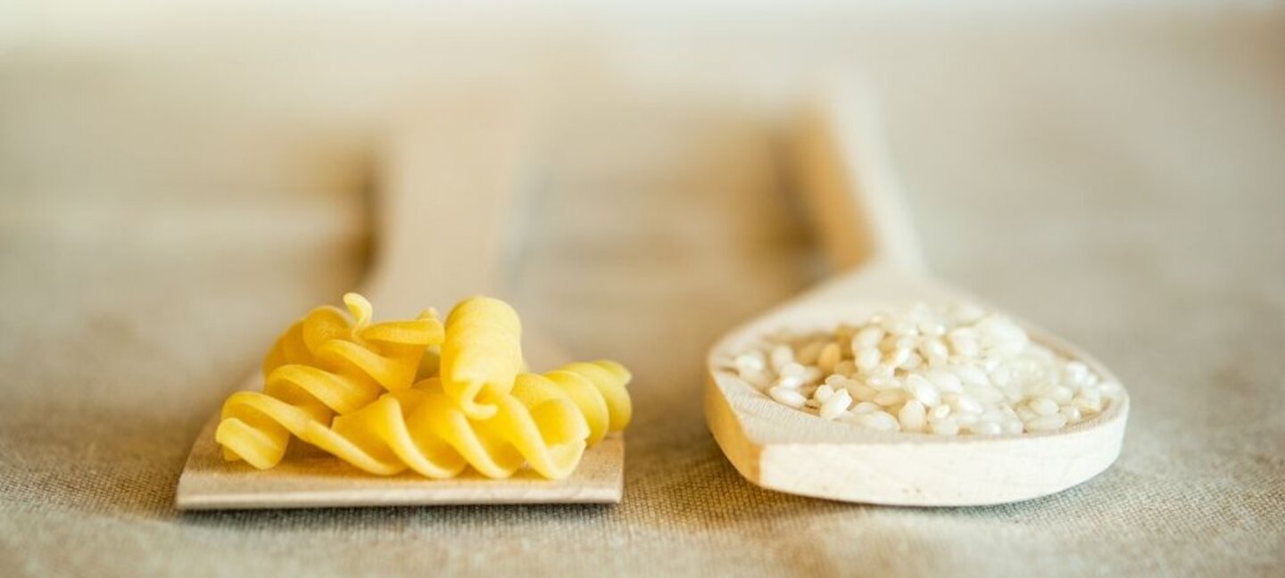 pasta and rice on spoons