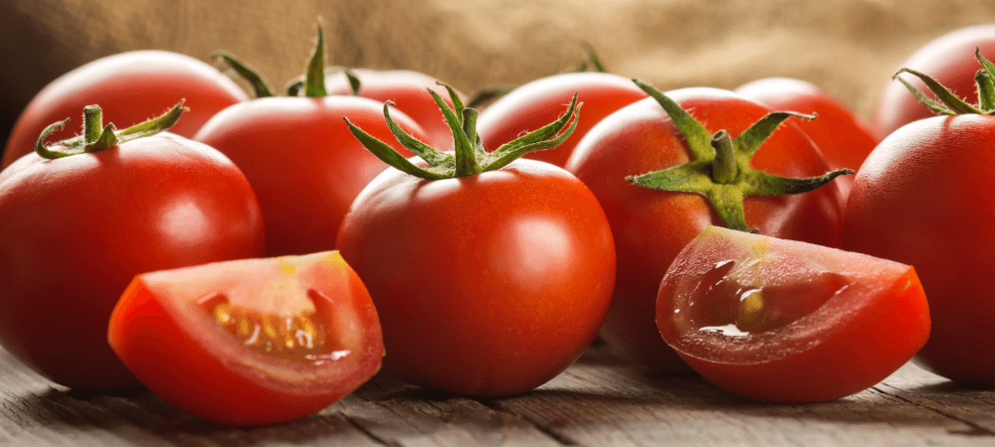 red tomatoes on a wooden table