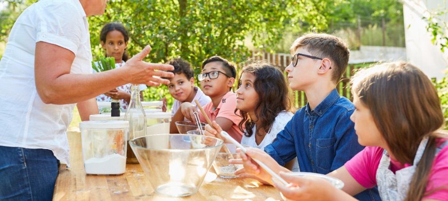 youth cooking outdoors