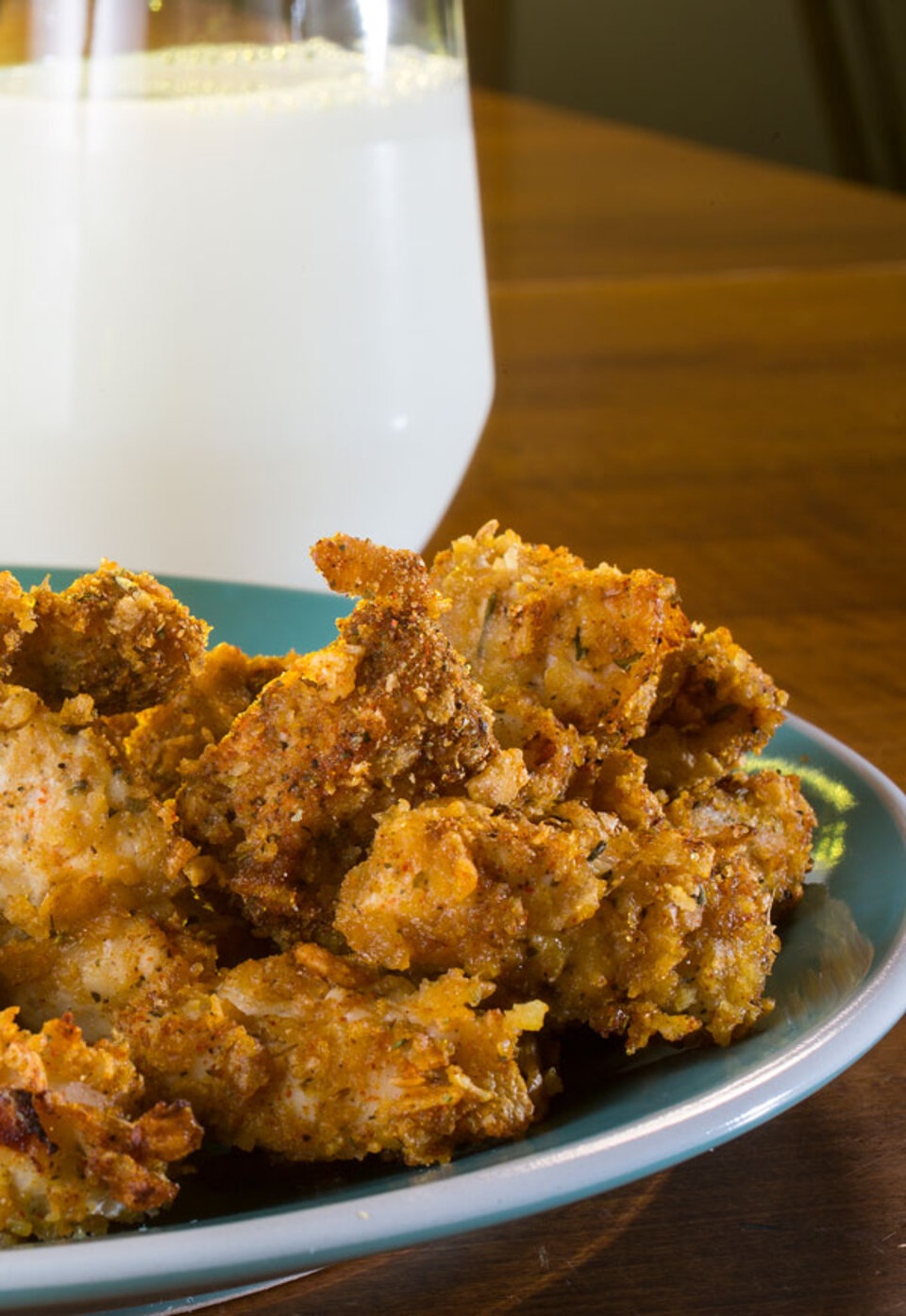 Chicken Nuggets on a plate with milk