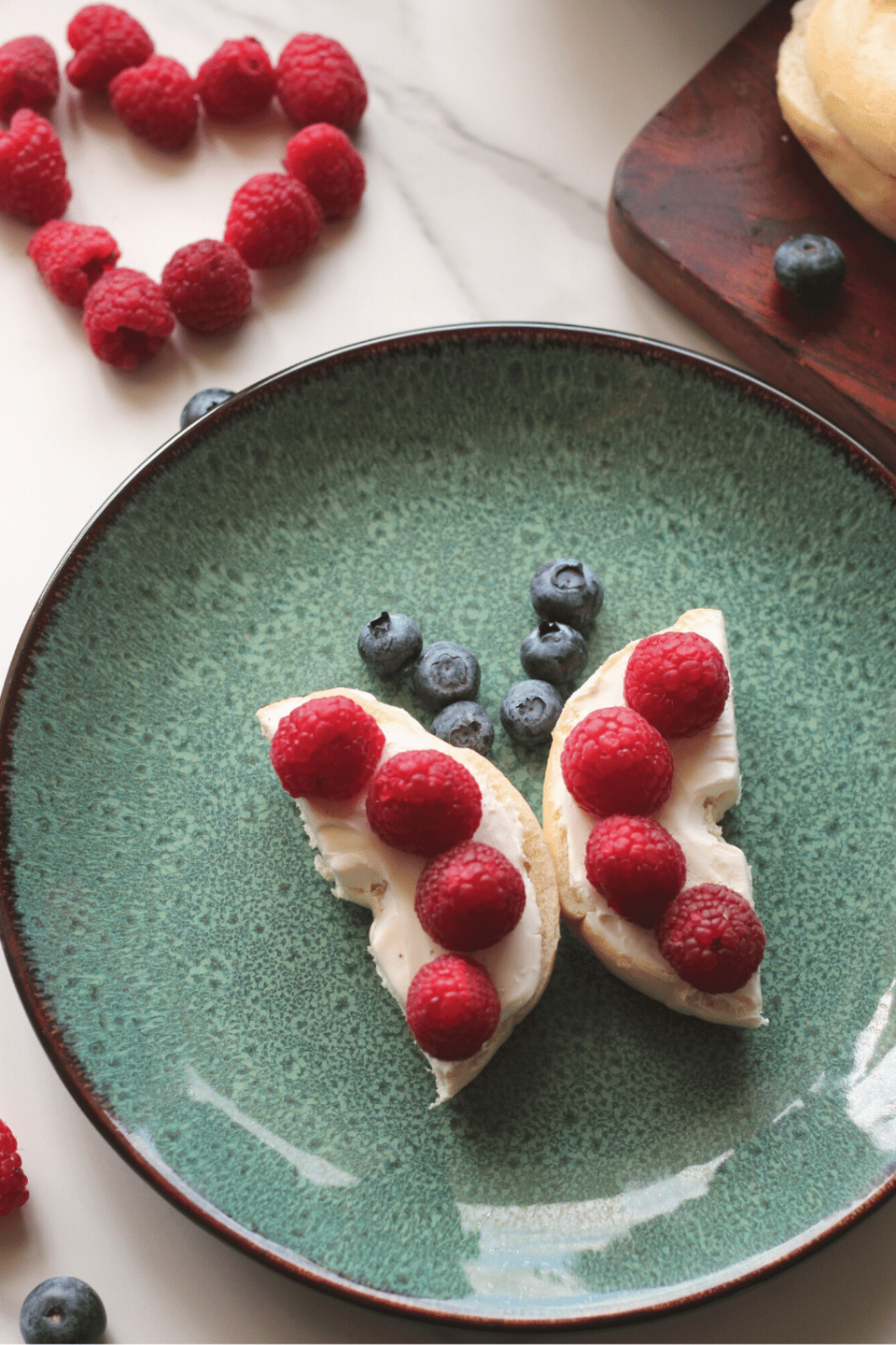 Mini bagel cut in half with berries