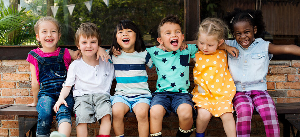 children sitting on a bench