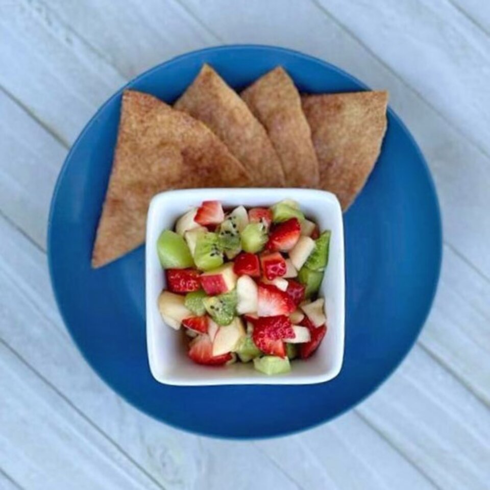 fresh fruit salsa with cinnamon crisps on blue plate