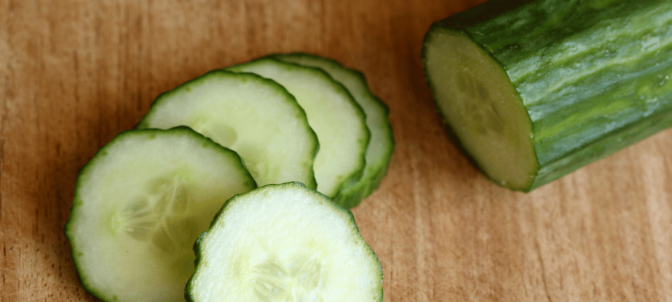 sliced cucumber on cutting board