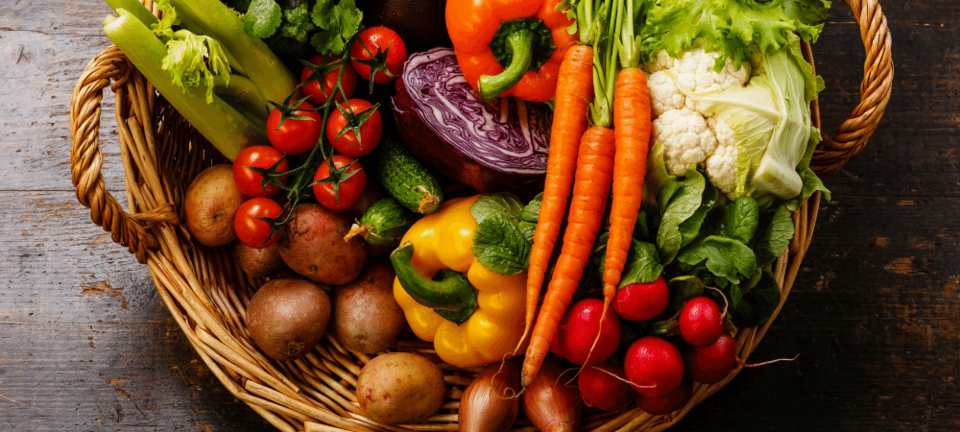 variety of fresh vegetables in a basket