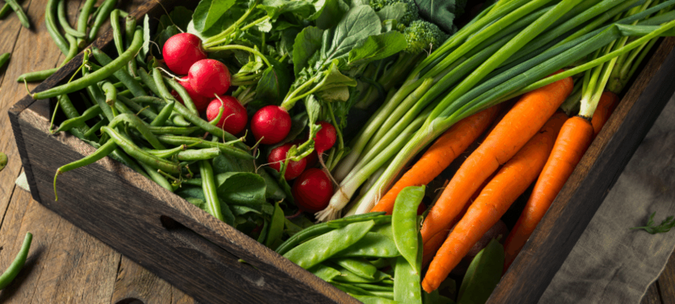variety of produce in a wooden box