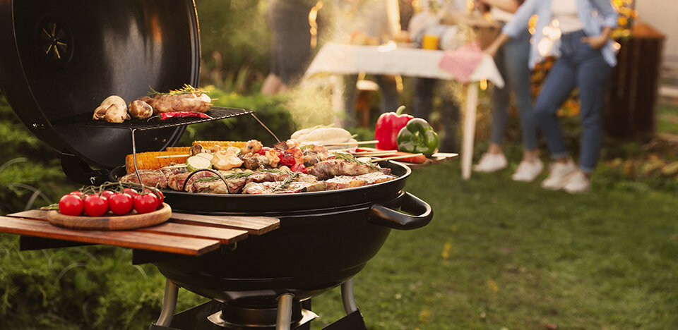 food on a grill at an outdoor party