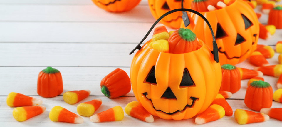 Halloween candy in jack o' lantern buckets