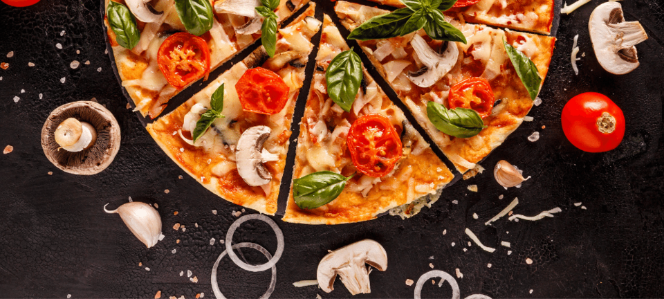 Italian pizza with mushrooms, tomatoes, onion, and basil