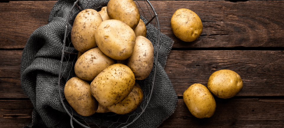 potatoes in a basket on a table