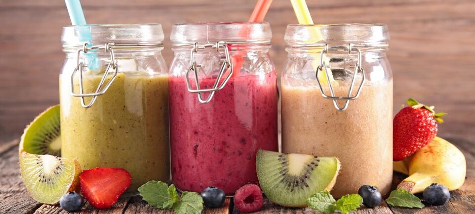 three types of smoothies in jars