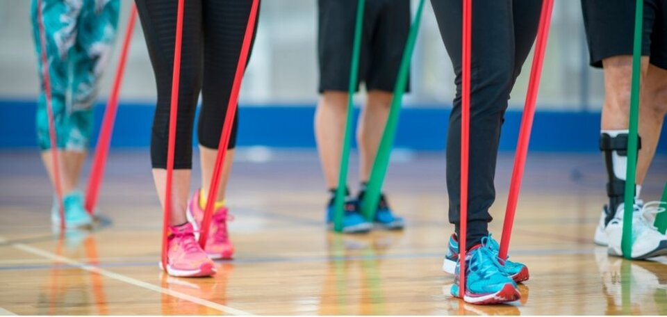 group of people using stretch bands