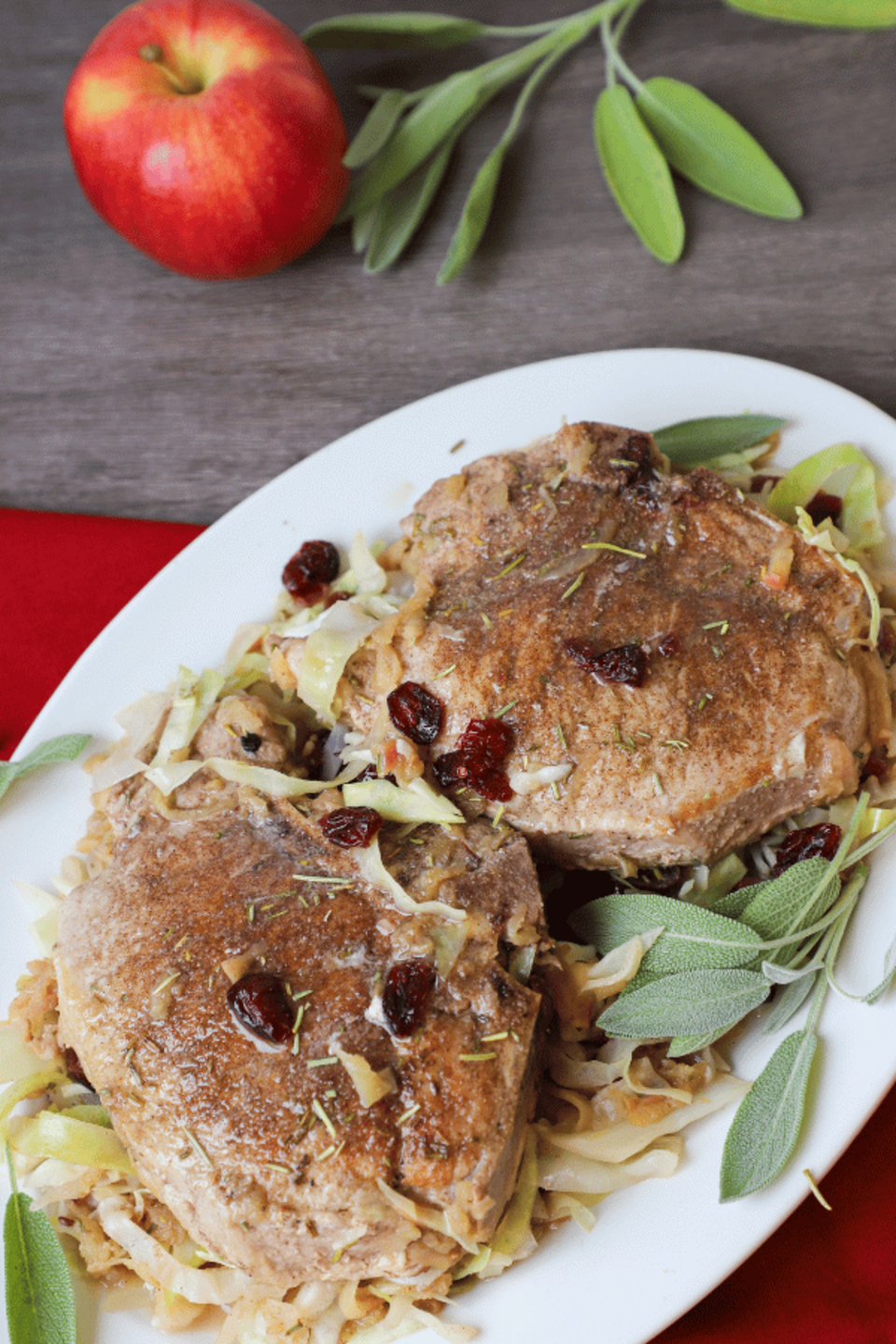 Two pork chops on a plate with cabbage