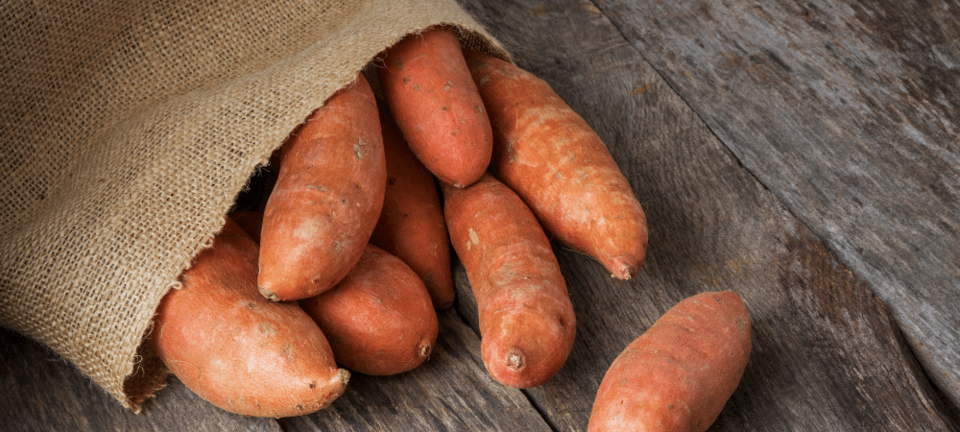 sweet potatoes in a burlap sack