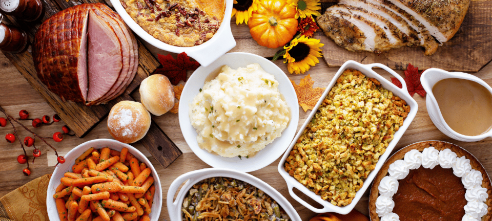 thanksgiving table with turkey and sides