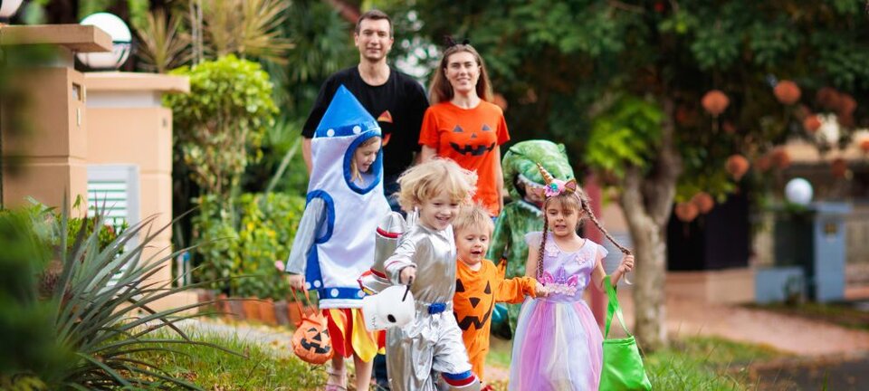 family trick or treating on Halloween
