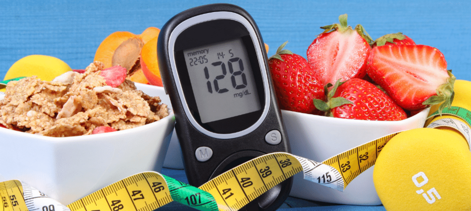 diabetes supplies such as glucose meter, healthy food, dumbbell, and measuring tape