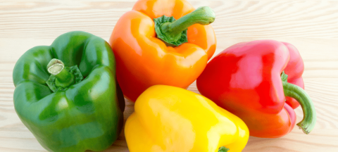 green, orange, red, and yellow bell pepper