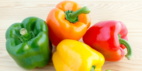 green, orange, red, and yellow bell pepper