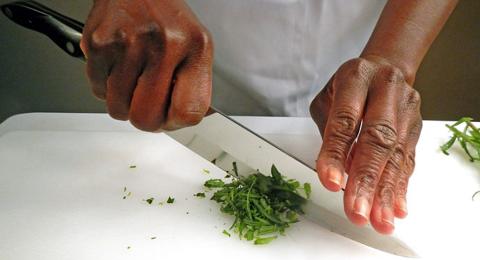 chopping herbs with a knife