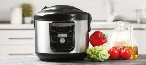 multi-cooker with vegetables, rice, oil