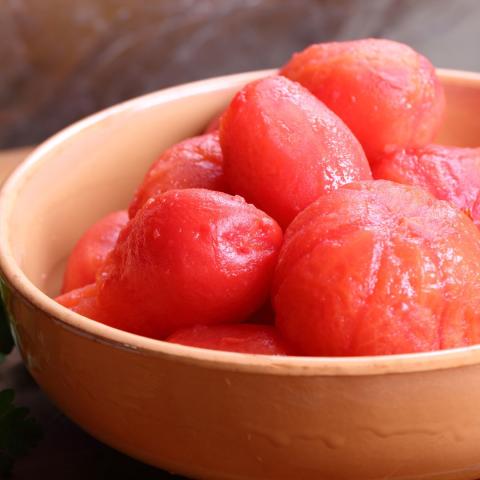 a bowl of peeled tomatoes
