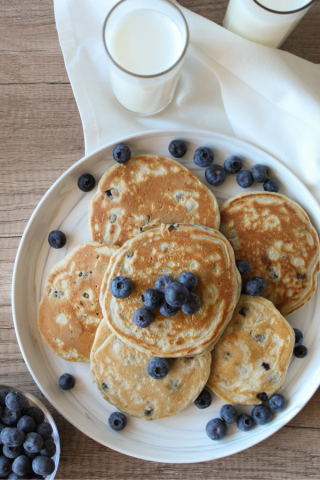 Pancakes on a plate with blueberries