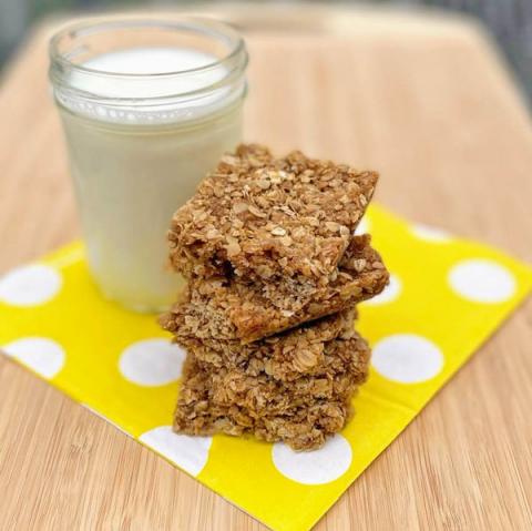 crunchy oat bars with a glass of milk