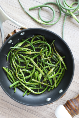 Garlic scapes in a skillet