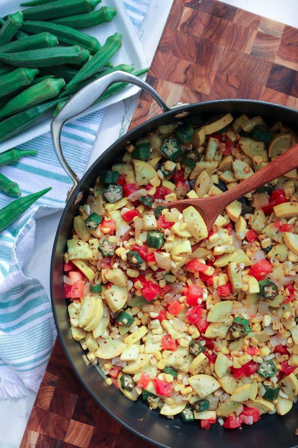 Skillet with okra succotash and fresh okra